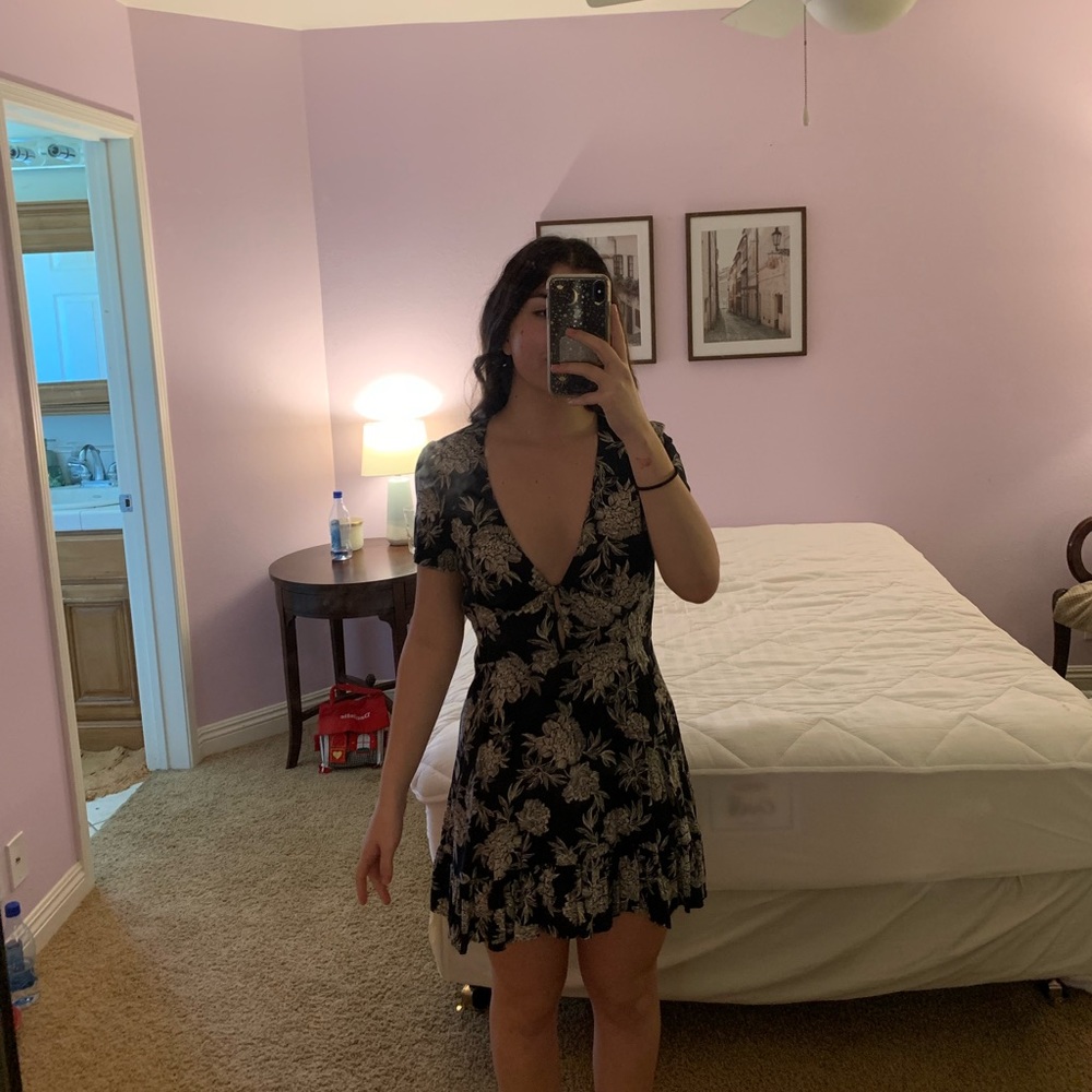 Olivaceous plunge v black with cream colored floral pattern mini dress